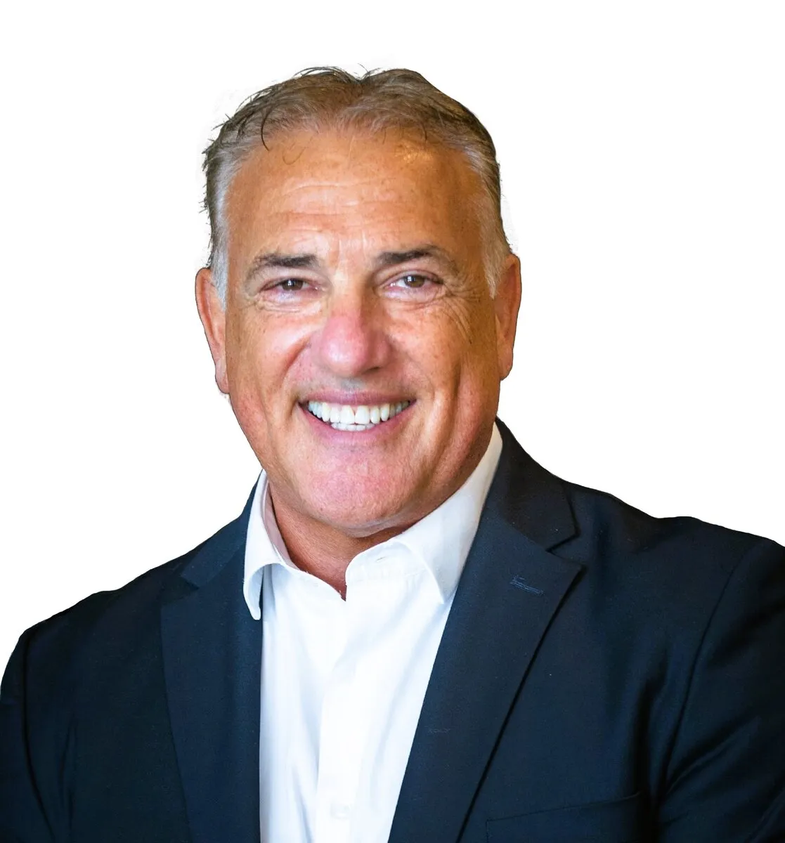 Samuel Seeff, chairman of the Seeff Property Group, smiling in a dark blazer and open-collared white shirt against a white background