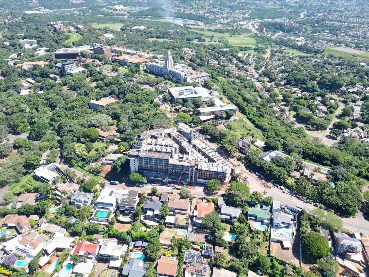 Aerial view of the Thrive Student Living student accommodation site under construction in Berea, Durban, among leafy suburban streets