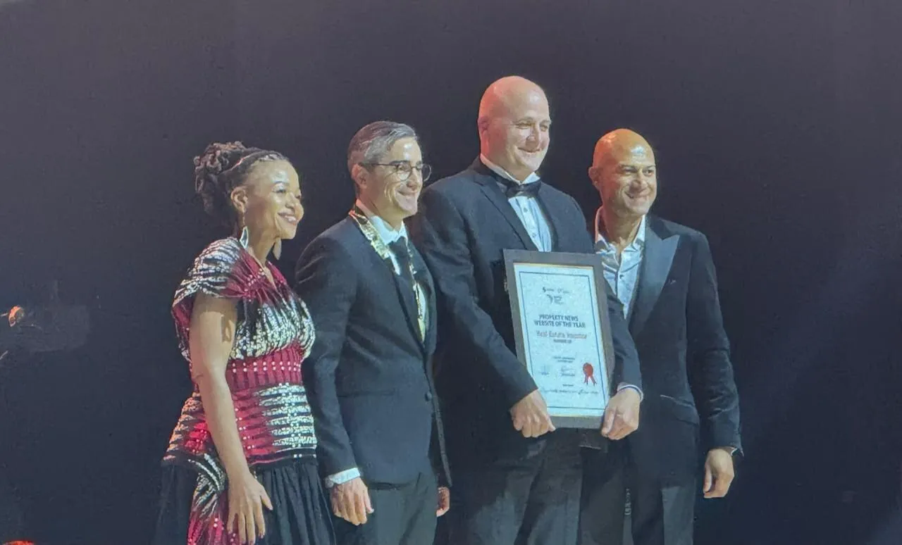 Real Estate Investor receives the runner-up certificate for Property News Website of the Year on stage at the SAPOA Journalism Awards for Excellence 2026 at Sun City